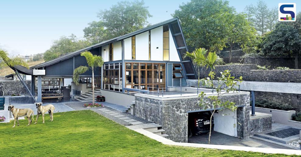 Located on a 10,000 sq ft plot, this amazingly stunning roof house has a high retaining wall on one side.