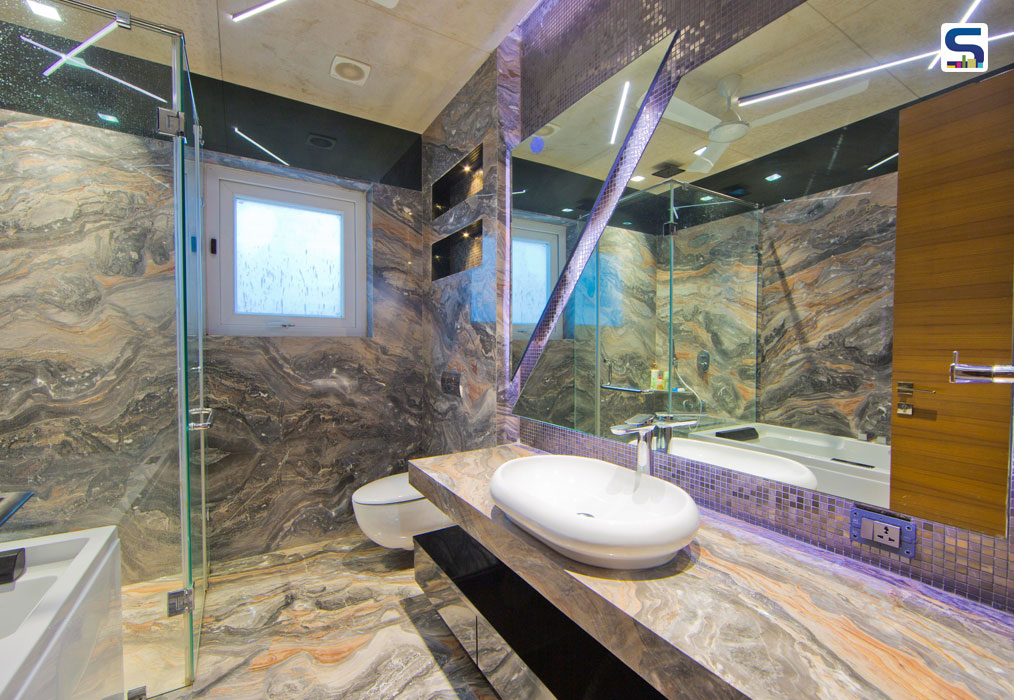 It is combined with their dresser. A huge window allowed ample natural light to enter this bathroom. Keeping in line with the neutral hues of the master bedroom, a neutral beigish-grey quartzite Statuario venato was chosen for this space.