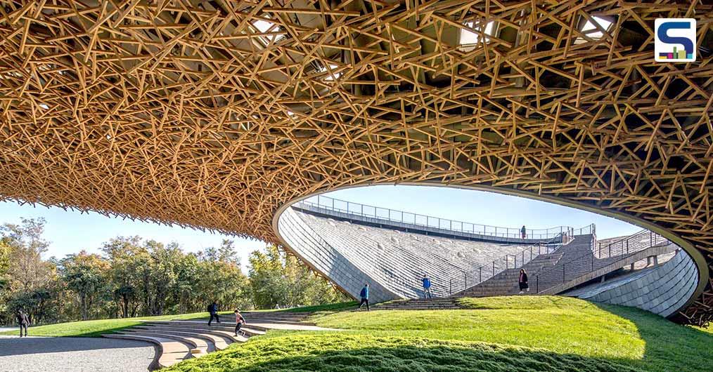 Zhu Pei Designs An Organic Landscape Underneath The Cantilevered Latticed Roof Of This Performing Arts Center In China