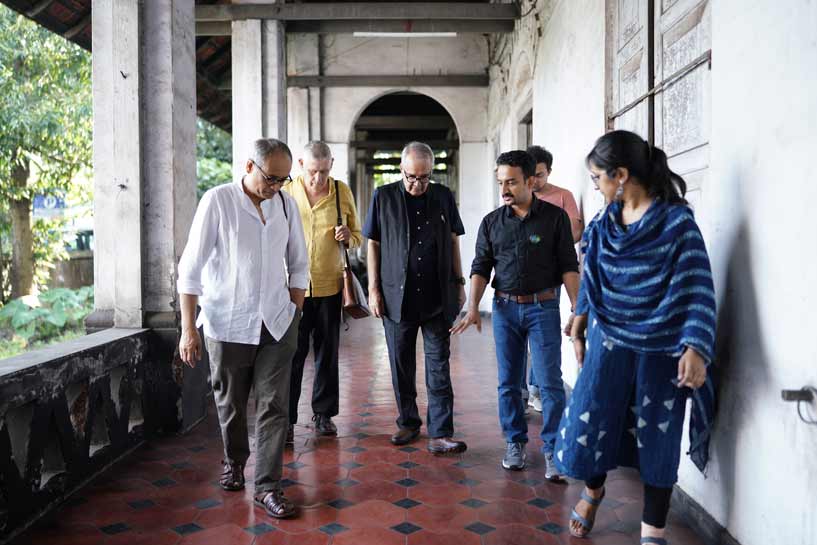 Jury for the National Design Competition: Reweave Kozhikode- Reimagining Comtrust and precicnts, visiting the site and the dilapidated buildings. From left, Ar.Soumitro Ghosh, Ar.Peter Rich, Prof. K. T. Ravindran, Ar.Prasoon, Co-convenor, Competitions, Crossroads- YAF 2022, Ar.Afifa Nuzhath, Co-convenor, Competitions, Crossroads- YAF 2022.