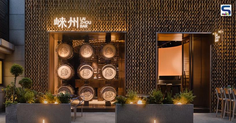 Chinese interiors studio RooMoo has undertaken a remarkable eco-conscious project, repurposing nearly 6,000 oak pieces from discarded distillery barrels to fashion the captivating interiors of Laizhou Bar in Shanghais vibrant Xuhui District.
