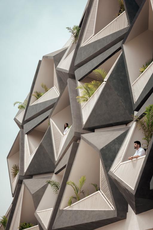 ovoid house-Laterite Stone House in Karnataka