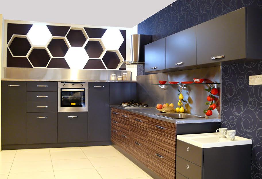 Modular kitchen range with built-in cooking hob, almost sits flush with the counter top and appears as a part of it. They also come with extra pullout slide which can work as a dining table as well, and no one can make it out whether it’s a cooking workstation or a dining area.