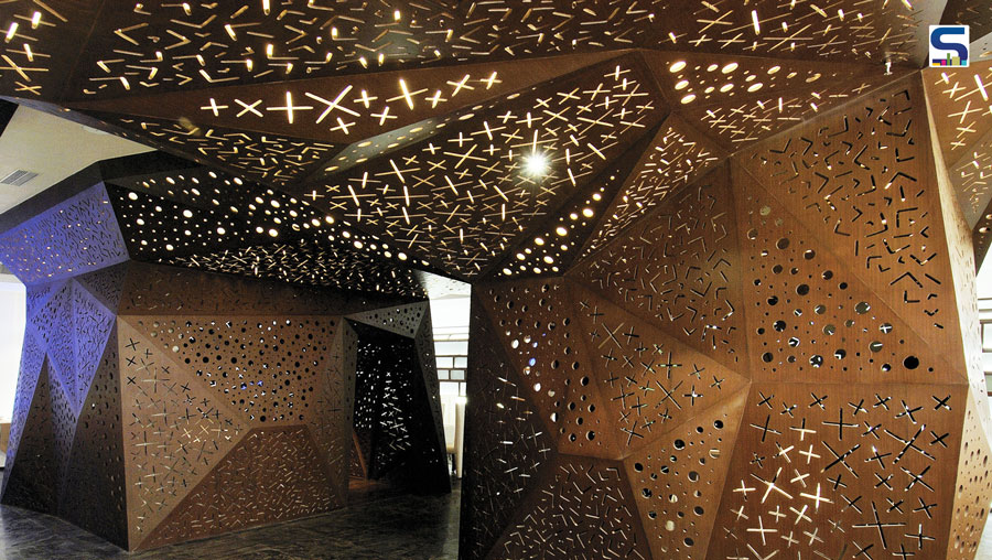 The hotel is planned in eight levels with public spaces occupying the first three levels and four levels of rooms above with a rooftop lounge bar on the topmost floor. Since there was nothing in the surroundings to look out to at the lower levels, the entire volume comprising the public spaces and the vertical circulation is punctuated by small 45 cm diameter circular openings