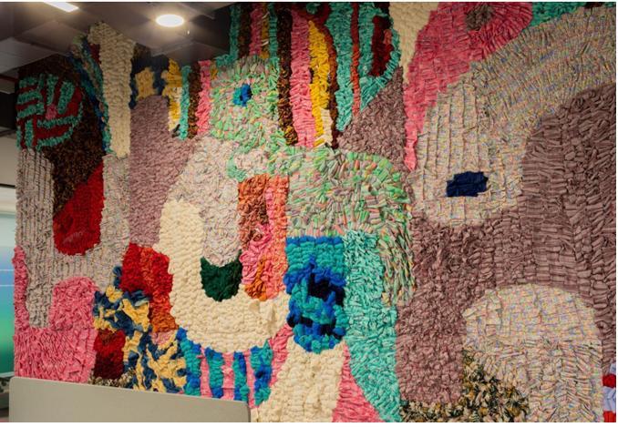 An art installation made of material from sample fabric pieces left behind at the conceptualization phase of fashion 