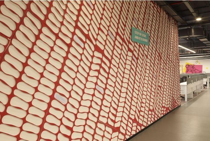 An art installation made of material from sample fabric pieces left behind at the conceptualization phase of fashion