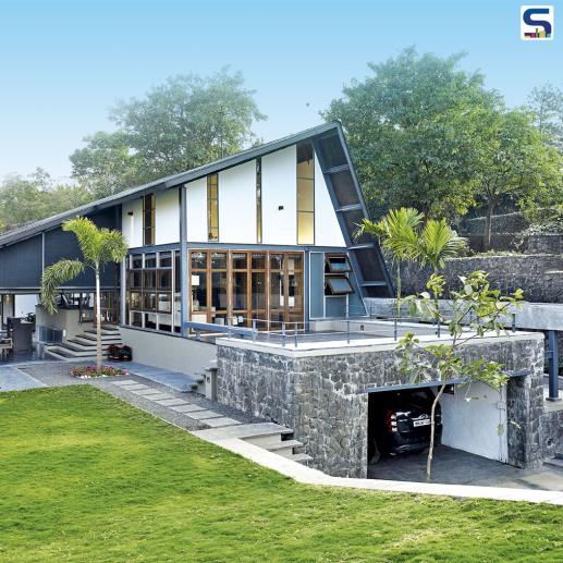 Located on a 10,000 sq ft plot, this amazingly stunning roof house has a high retaining wall on one side.