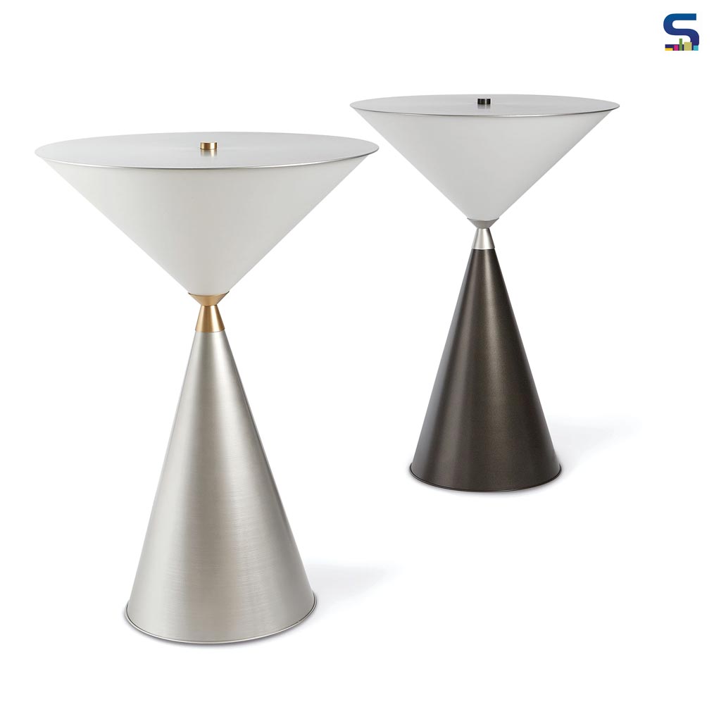 The table lamp with its two cones in aluminium and polycarbonate, joined by a brass jewel in the centre, amazes and seduces with its perfect static and formal balance.