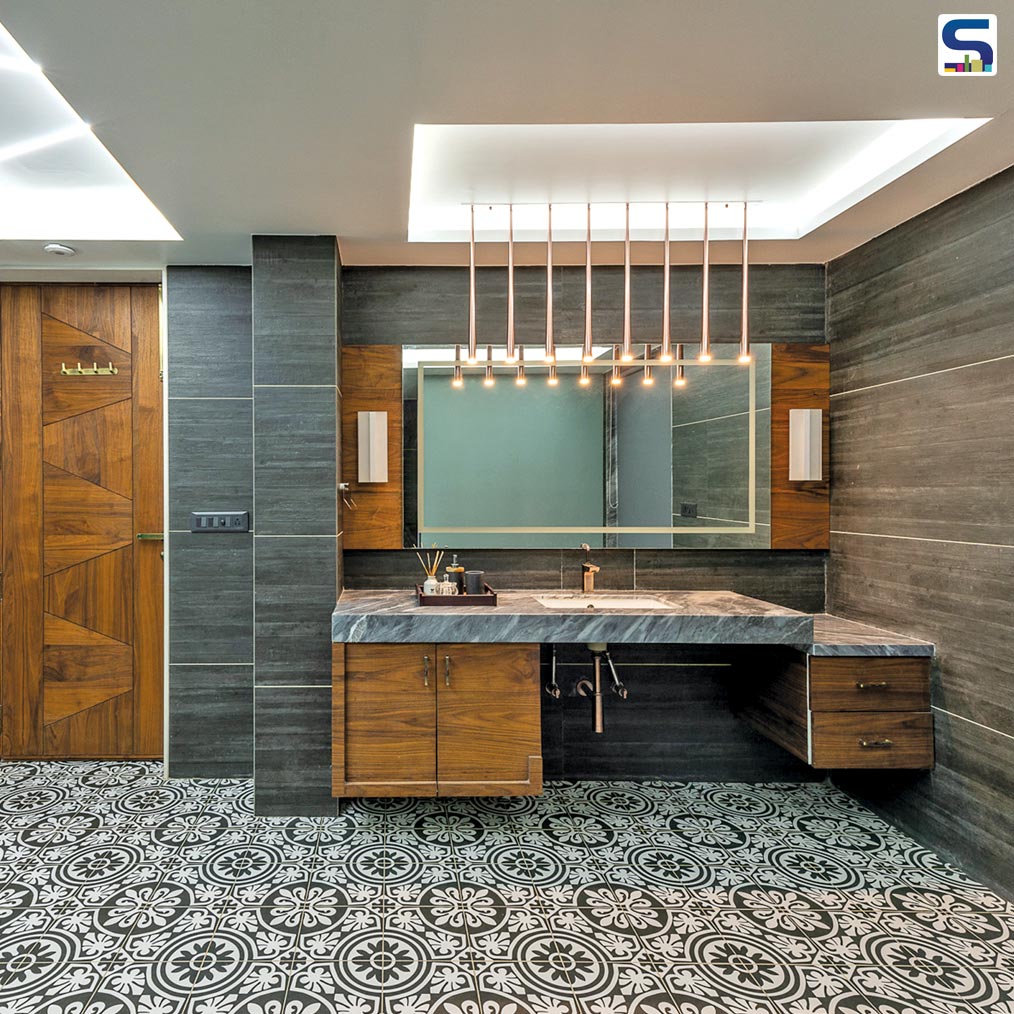 The KT House’s bathroom is a spacious 120 sq ft one. This being the young son’s bathroom, the colour scheme carried forward for his bedroom is of greys, black and white along with the warmth of some wood finishes & a metallic highlight with brass plumbing and light fixtures.