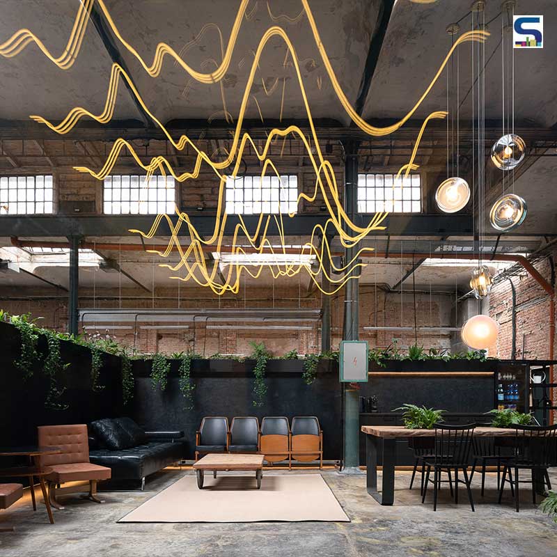 Industrial Aesthetic Combined with Sound-Wave Shaped Neon Lights Dominate This Former Factory in the Czech Republic