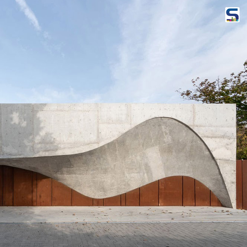 Wavy Concrete Form Softens The Corten Steel Frame of This house | Arresting Entrance | Moldova | Calujac Architecture